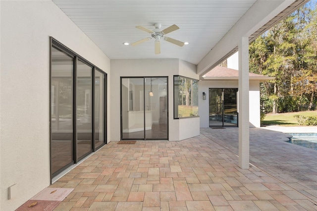 view of patio / terrace featuring ceiling fan