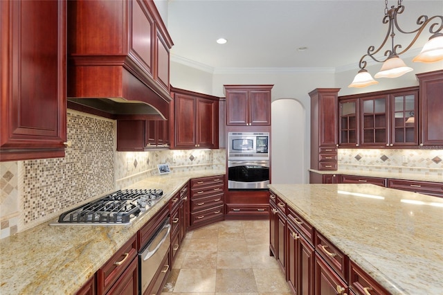 kitchen featuring appliances with stainless steel finishes, crown molding, backsplash, and hanging light fixtures