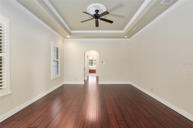 spare room featuring ceiling fan, crown molding, and a tray ceiling