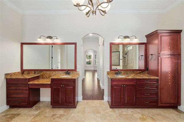 bathroom with tasteful backsplash, vanity, walk in shower, a notable chandelier, and ornamental molding