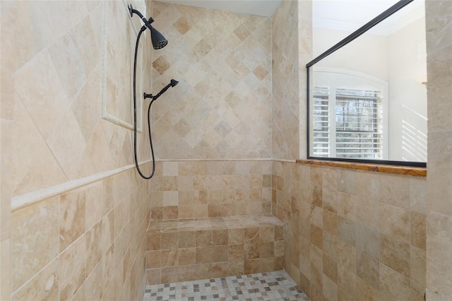 bathroom featuring a tile shower