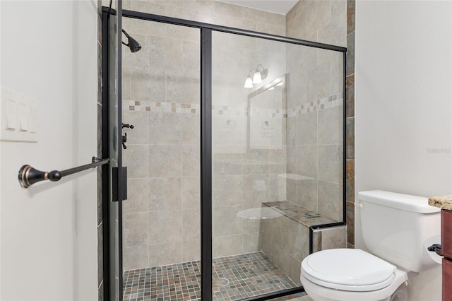 bathroom with an enclosed shower and toilet