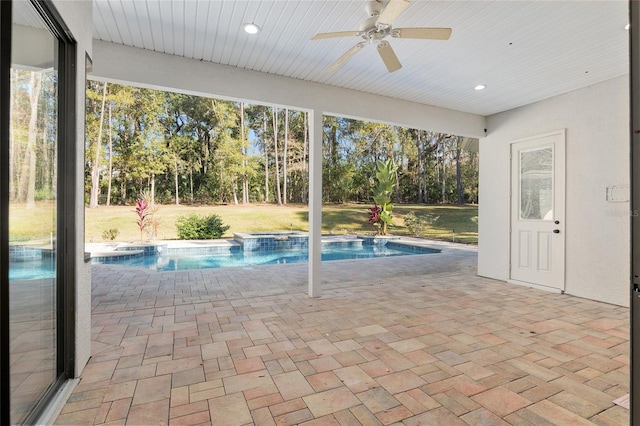 view of pool featuring ceiling fan, a lawn, and a patio