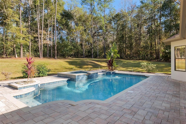 view of pool featuring a patio area, an in ground hot tub, and a yard