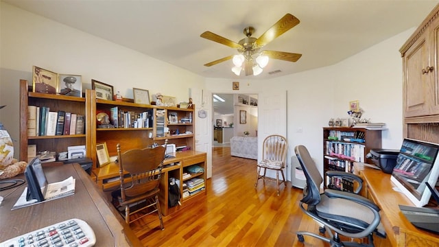 home office featuring ceiling fan and hardwood / wood-style flooring