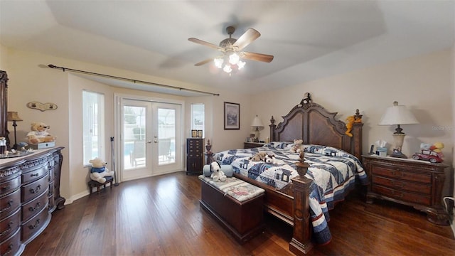 bedroom featuring a raised ceiling, ceiling fan, dark hardwood / wood-style flooring, french doors, and access to outside