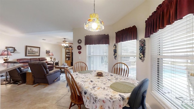 dining room featuring ceiling fan and light tile patterned flooring