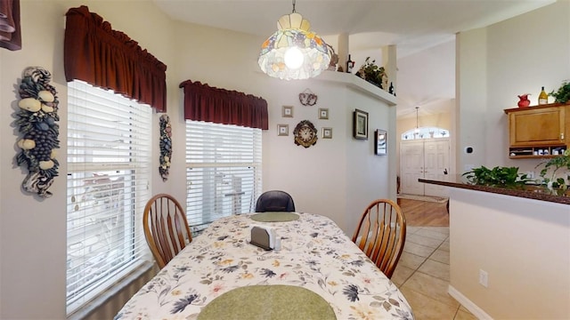 dining area featuring light tile patterned floors