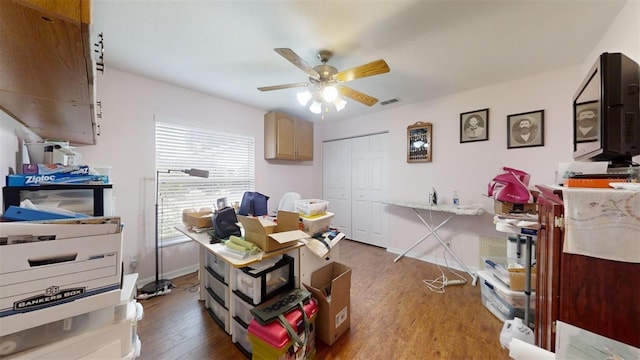 miscellaneous room with ceiling fan and hardwood / wood-style floors