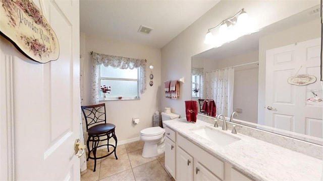 bathroom with toilet, tile patterned floors, walk in shower, and vanity