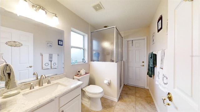 bathroom featuring tile patterned floors, an enclosed shower, vanity, and toilet