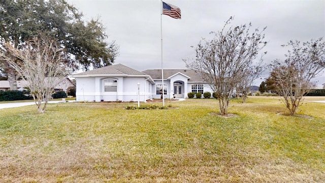 ranch-style home featuring a front yard