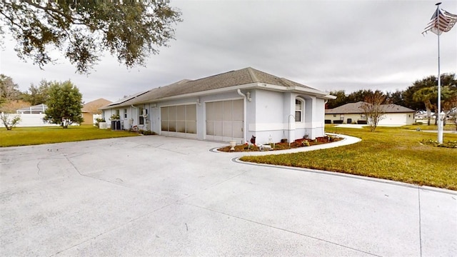 view of side of property with a yard and a garage