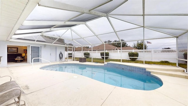 view of pool with a lanai and a patio area