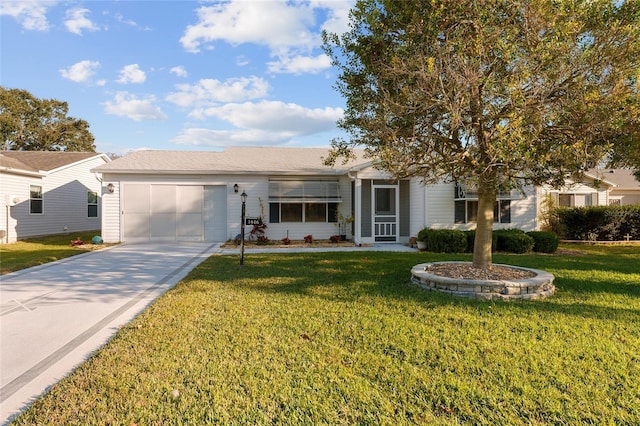 ranch-style house featuring a front yard and a garage