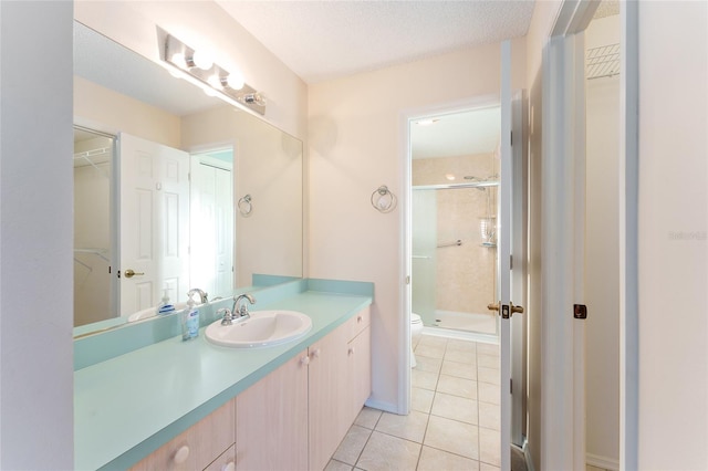 bathroom featuring tile patterned floors, toilet, walk in shower, and a textured ceiling