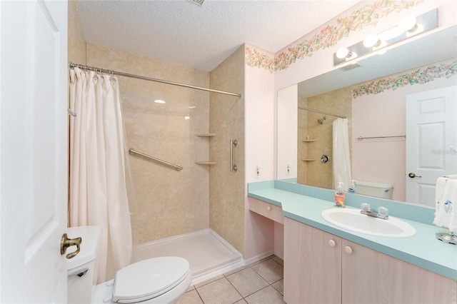 bathroom featuring tile patterned floors, a textured ceiling, toilet, vanity, and a shower with shower curtain