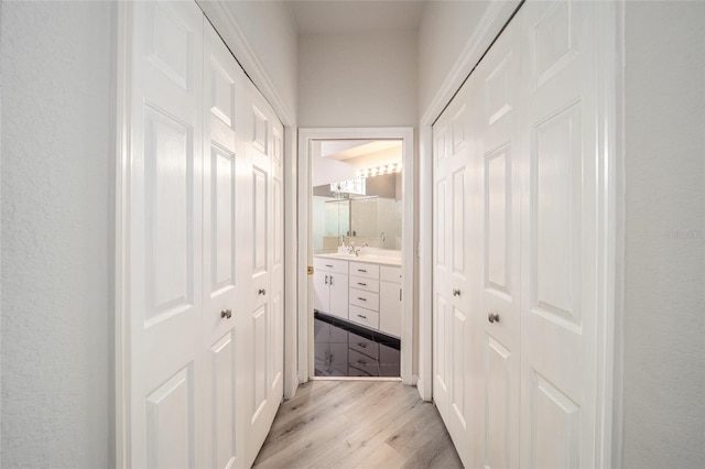 corridor featuring light hardwood / wood-style flooring