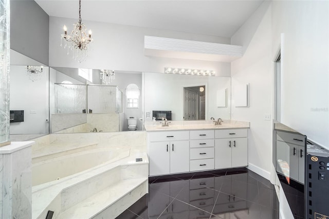 bathroom featuring vanity, tile patterned flooring, toilet, tiled tub, and a chandelier