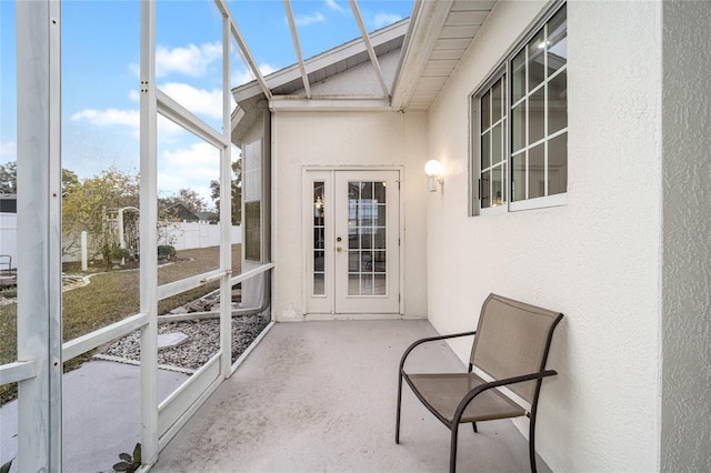 sunroom / solarium with french doors and lofted ceiling