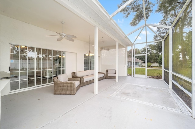 unfurnished sunroom with ceiling fan with notable chandelier and lofted ceiling