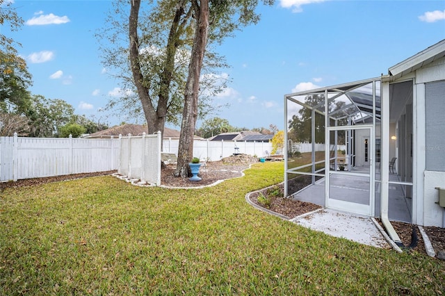 view of yard with a lanai