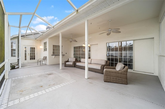 view of patio / terrace featuring an outdoor living space, french doors, a lanai, and ceiling fan