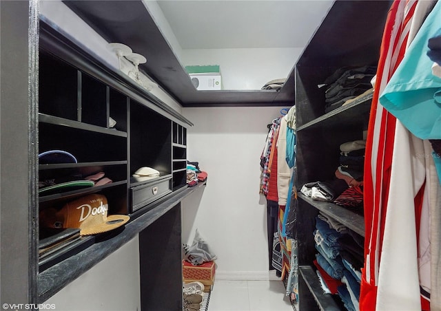 walk in closet featuring tile patterned flooring