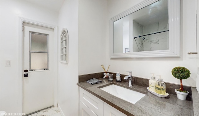 bathroom with vanity and a shower