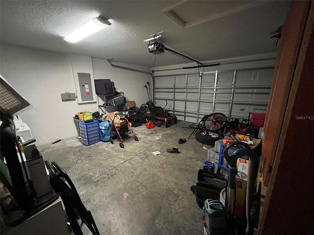 garage featuring a garage door opener and electric panel