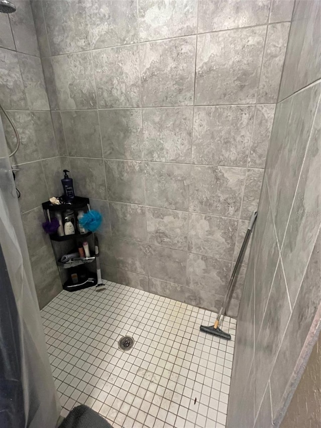 bathroom with tiled shower