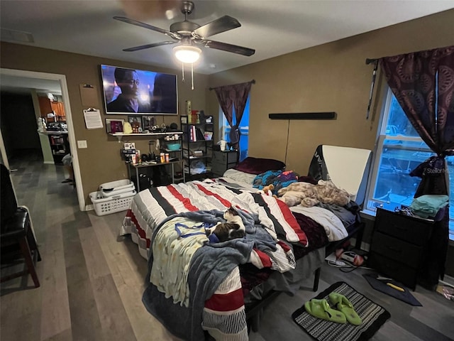 bedroom featuring ceiling fan and wood-type flooring