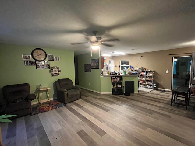 interior space with ceiling fan and hardwood / wood-style flooring