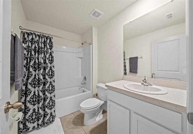 full bathroom with tile patterned flooring, shower / bath combination with curtain, a textured ceiling, toilet, and vanity