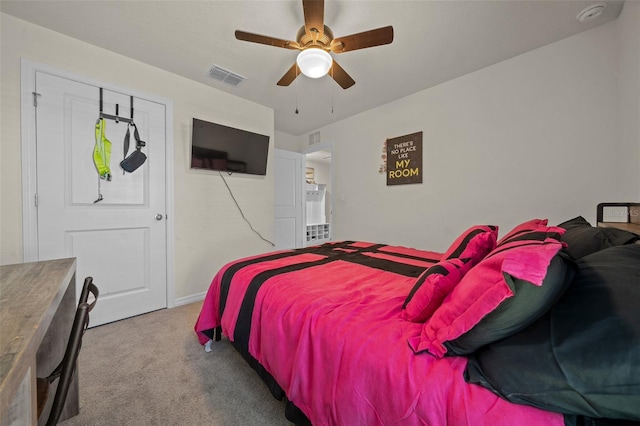 bedroom with ceiling fan and light colored carpet