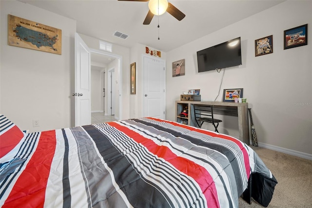 bedroom featuring ceiling fan and light colored carpet