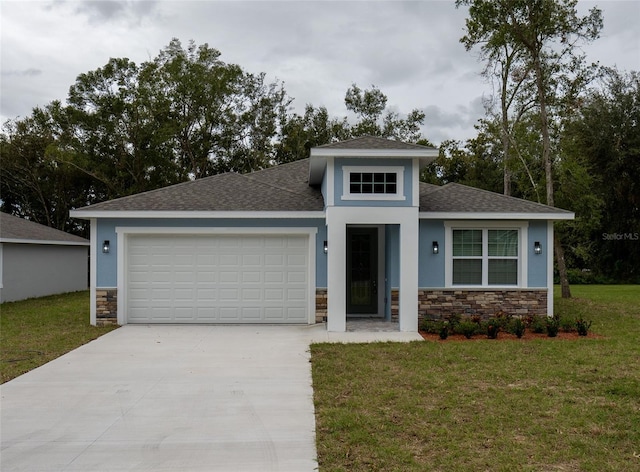 view of front of home featuring a front yard and a garage