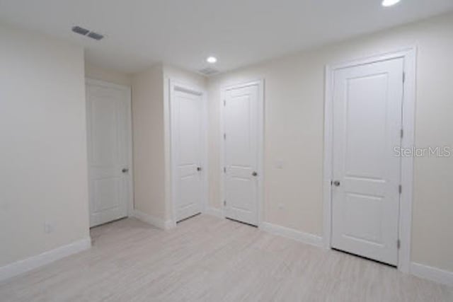 unfurnished bedroom with light hardwood / wood-style floors