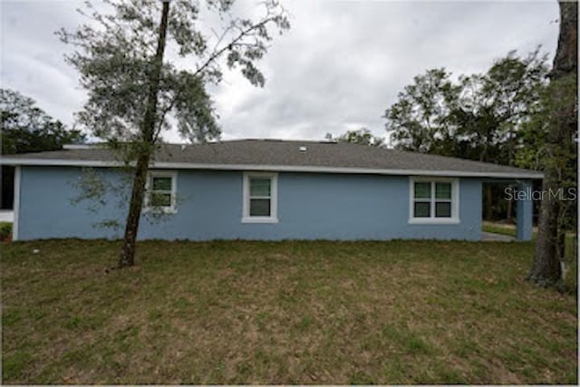 view of property exterior with a yard