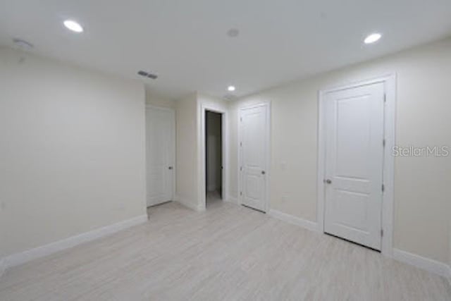 unfurnished bedroom featuring light hardwood / wood-style floors