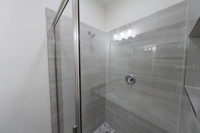 bathroom featuring an enclosed shower