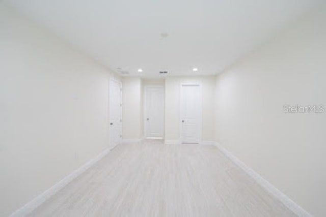 spare room with light wood-type flooring