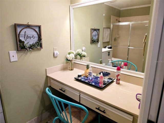 bathroom featuring walk in shower, vanity, and ornamental molding