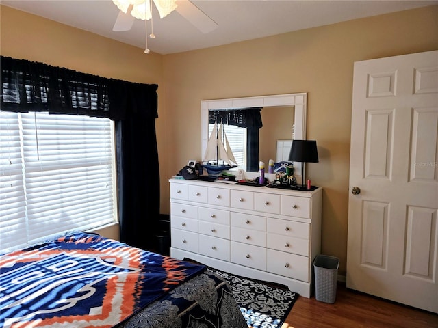 bedroom featuring dark hardwood / wood-style floors and ceiling fan