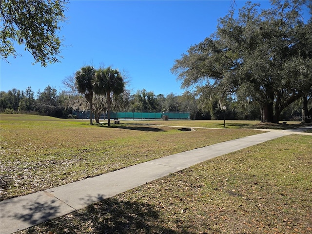 surrounding community featuring a yard