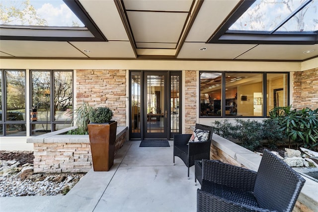 doorway to property featuring a patio