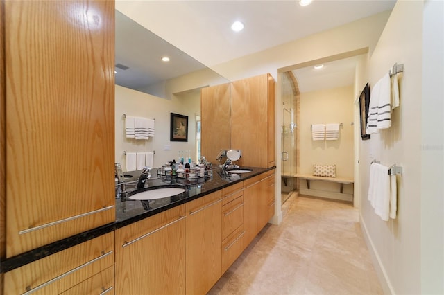 bathroom featuring vanity and walk in shower