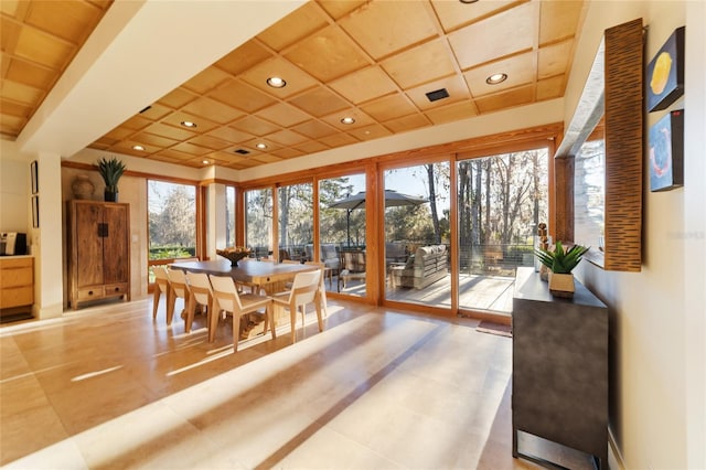 sunroom / solarium featuring coffered ceiling