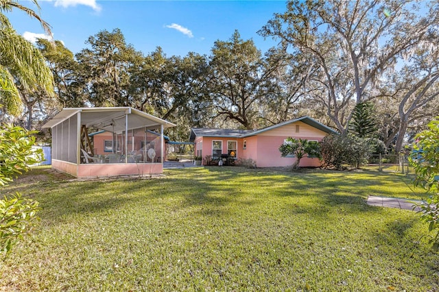 view of yard featuring a sunroom