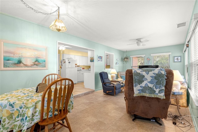 dining space featuring ceiling fan